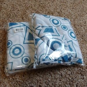 White curtains with teal accents